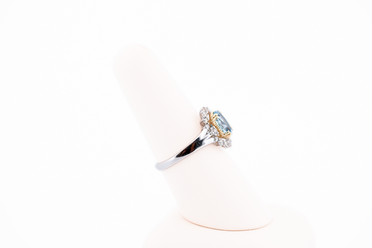Deep Color Oval Aquamarine Ring with Diamond Halo in Two-Tone Gold