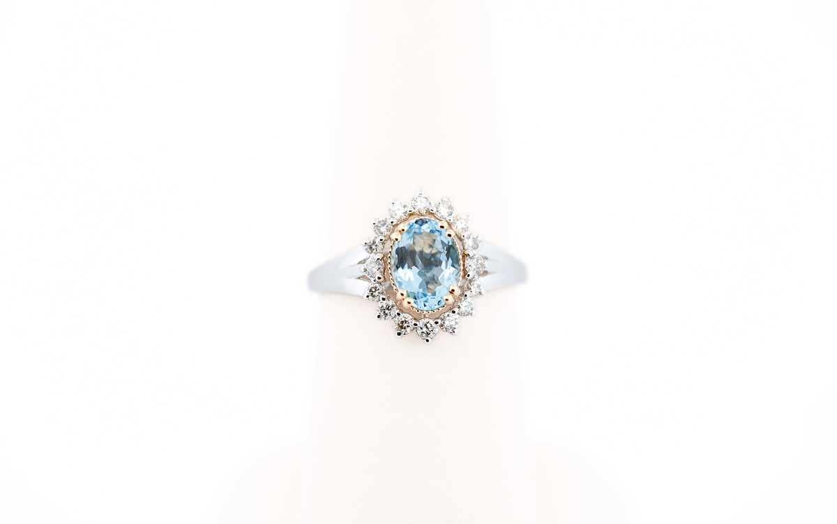 Deep Color Oval Aquamarine Ring with Diamond Halo in Two-Tone Gold