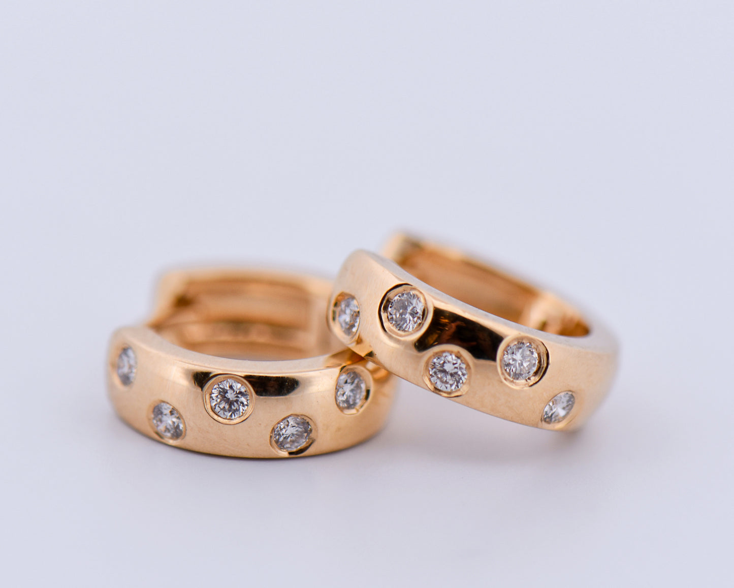 Etoile Diamond Huggie Hoops in Yellow Gold