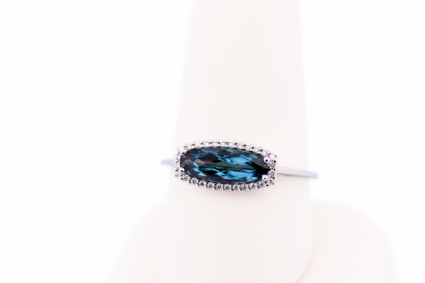 East-West Blue Topaz and Diamond Halo Ring