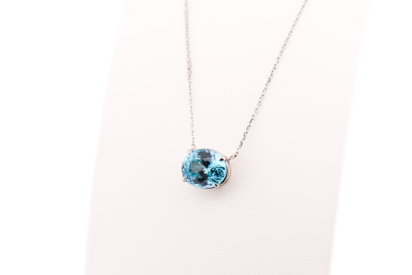 East-West Blue Zircon Solitaire Pendant in 14k White Gold