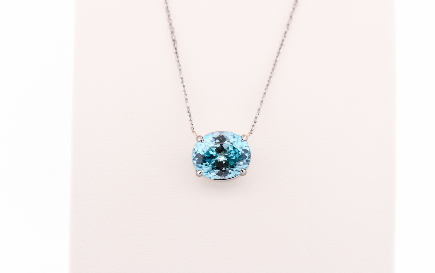 East-West Blue Zircon Solitaire Pendant in 14k White Gold
