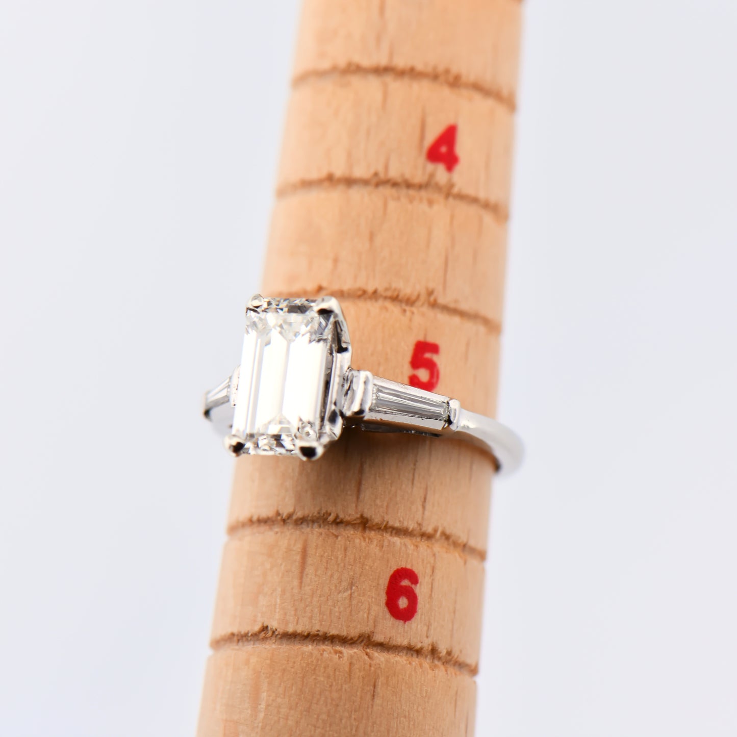 Elongated Emerald Cut Diamond Ring with Baguette Accents in Platinum