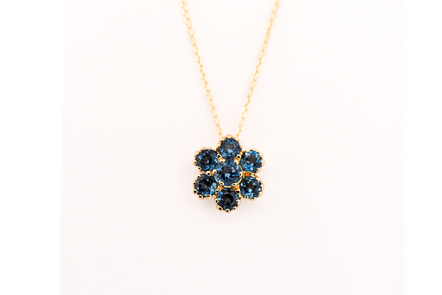 Estate London Blue Topaz Flower Cluster Pendant in Yellow Gold