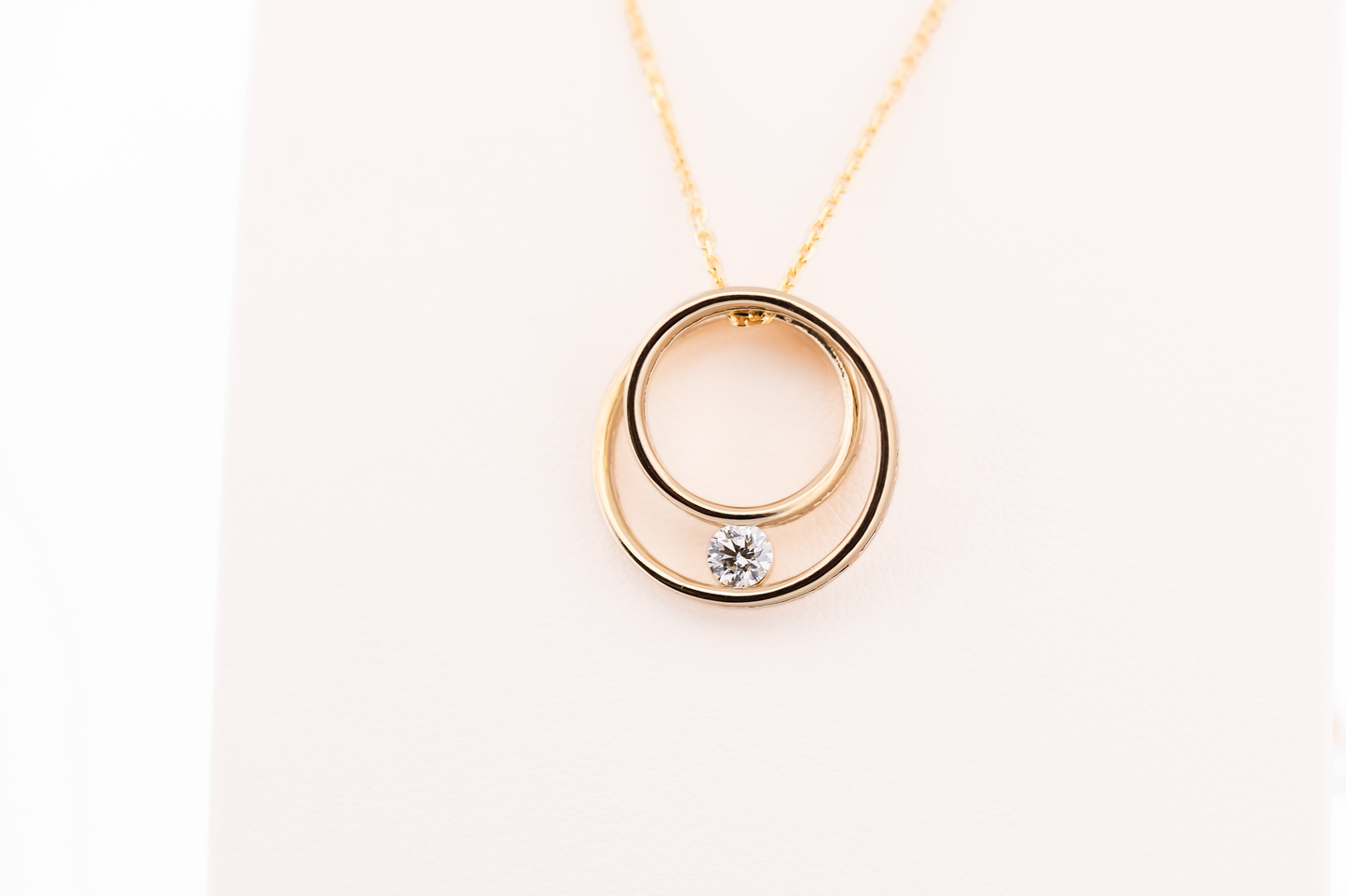 Eternal Circle Pendant in 14k Yellow Gold with Diamond Accent