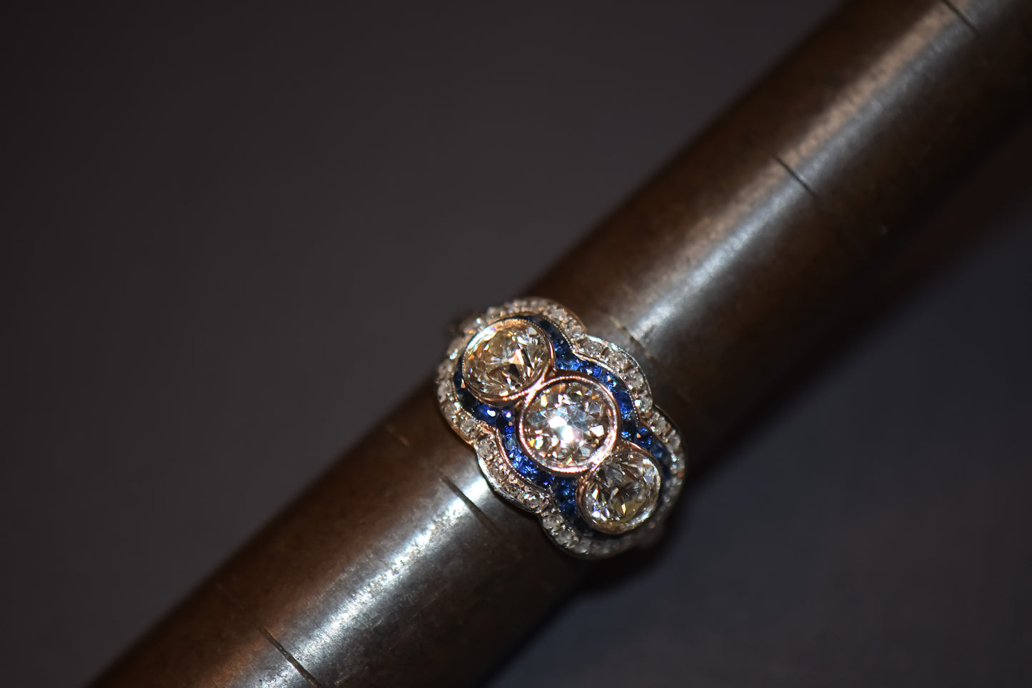 Exceptional Art Deco Platinum Diamond 3-Stone Ring with Sapphire Accents