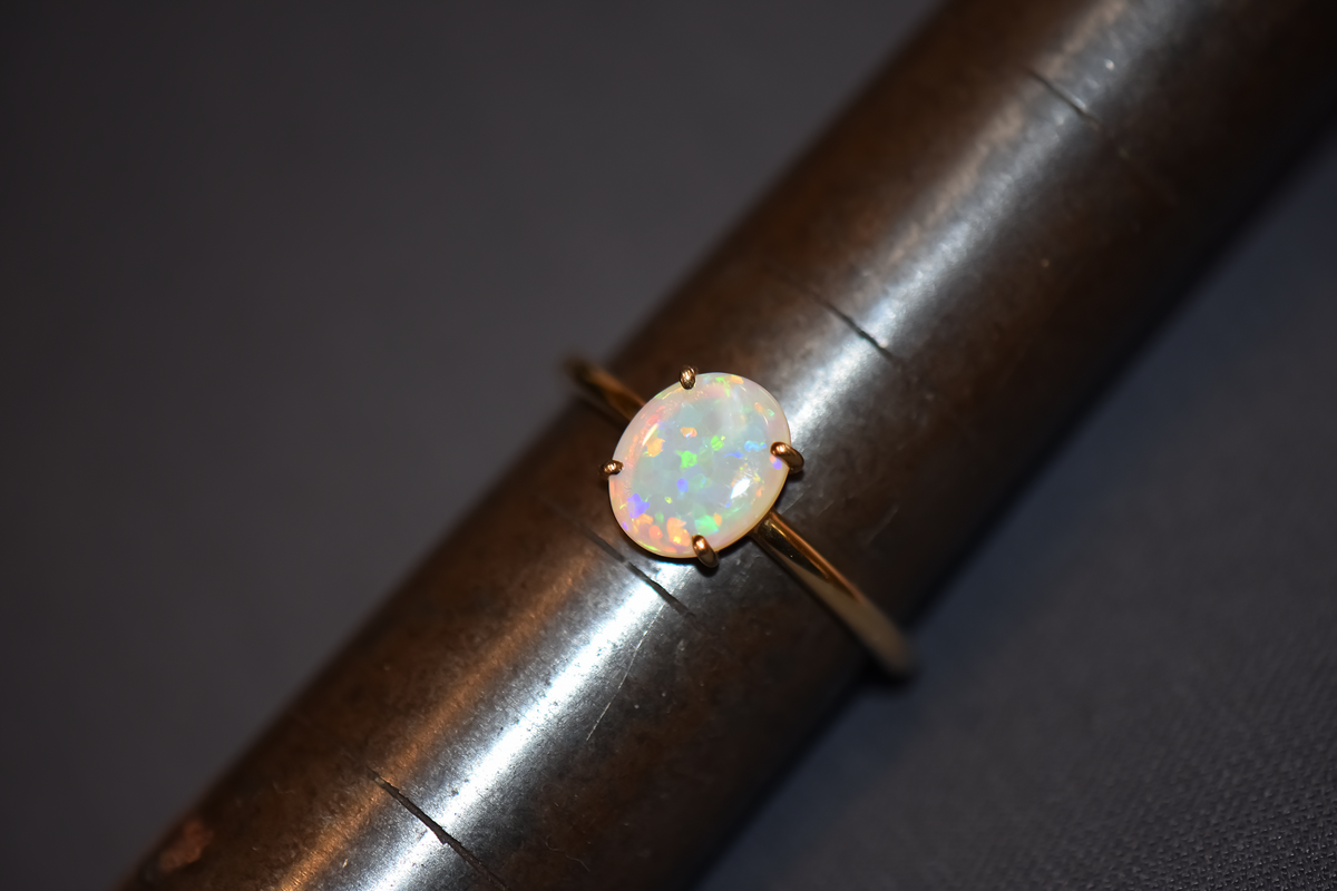 Glittery Opal Solitaire Engagement Ring in Yellow Gold