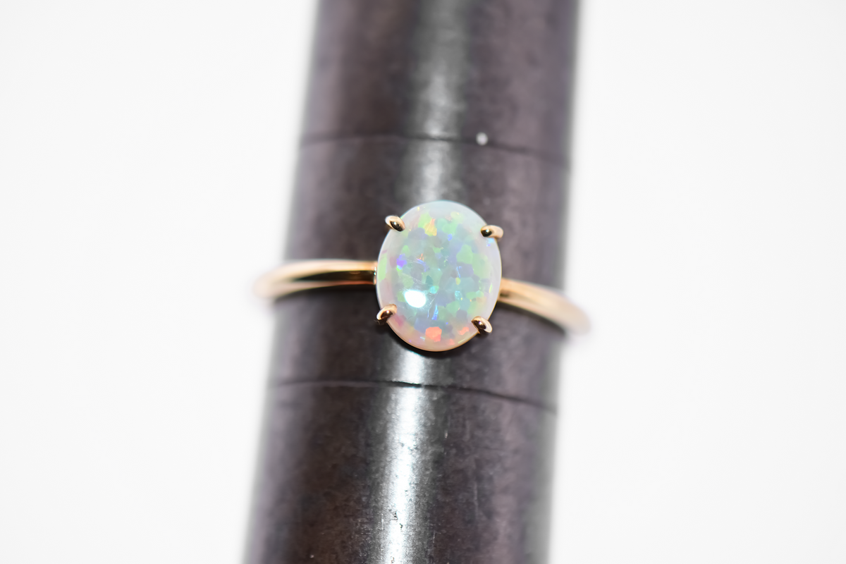 Glittery Opal Solitaire Engagement Ring in Yellow Gold