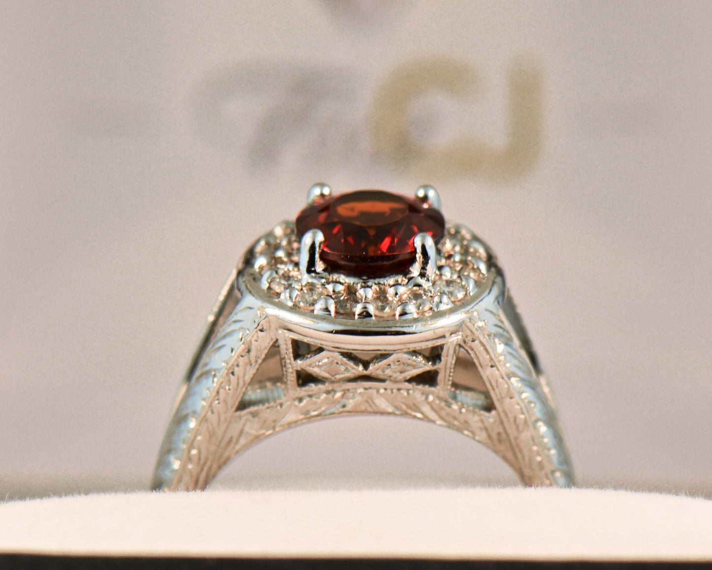 Carved White Gold Ring with Round Red Hessonite Garnet