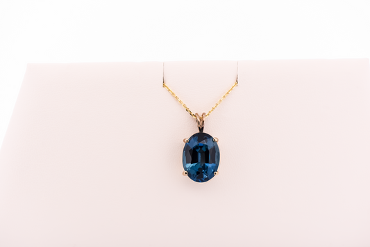 London Blue Topaz Oval Solitaire Pendant in 14k Yellow Gold