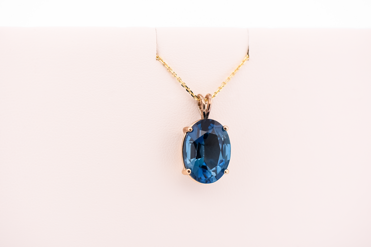 London Blue Topaz Oval Solitaire Pendant in 14k Yellow Gold