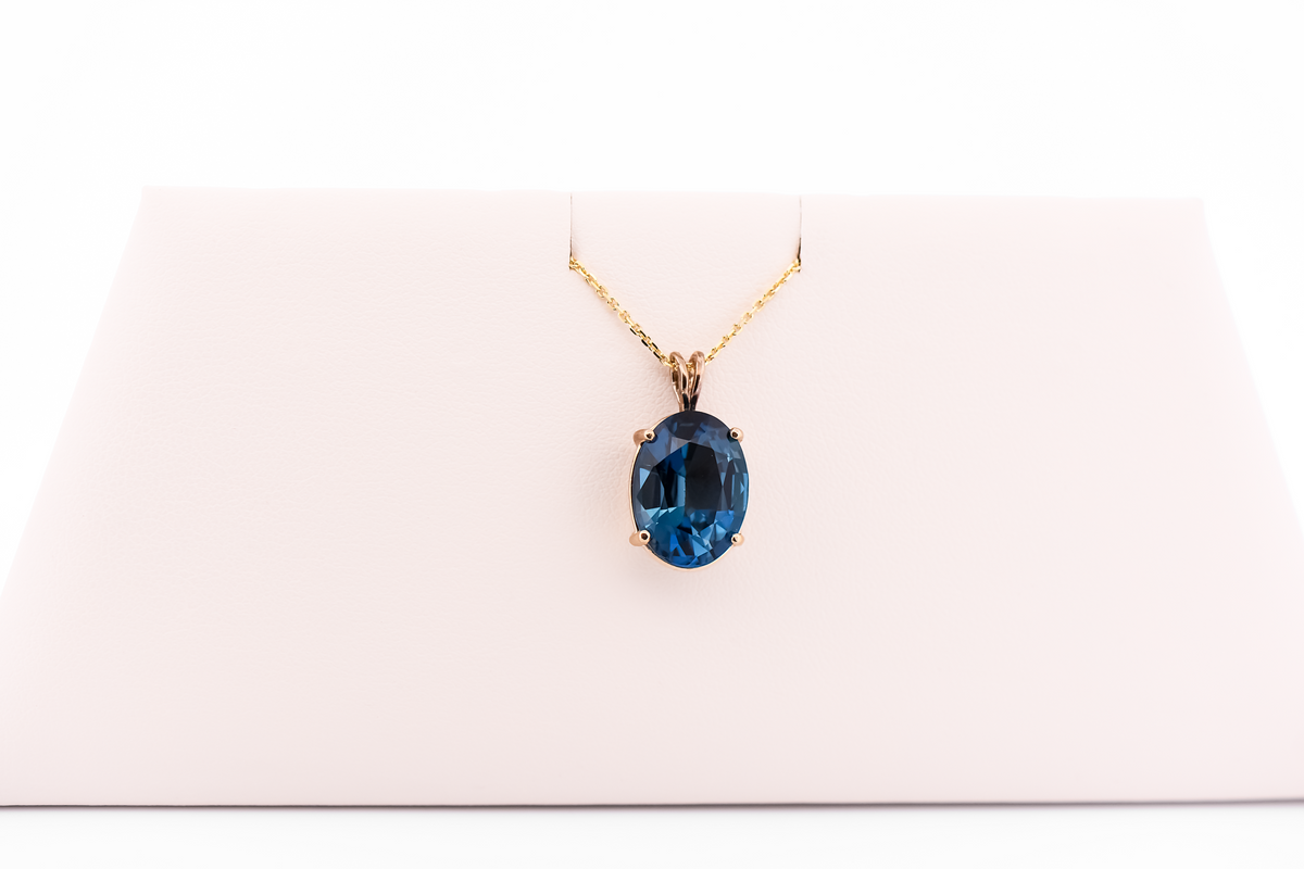 London Blue Topaz Oval Solitaire Pendant in 14k Yellow Gold