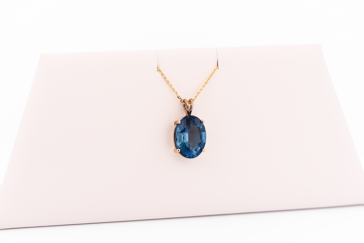 London Blue Topaz Oval Solitaire Pendant in 14k Yellow Gold