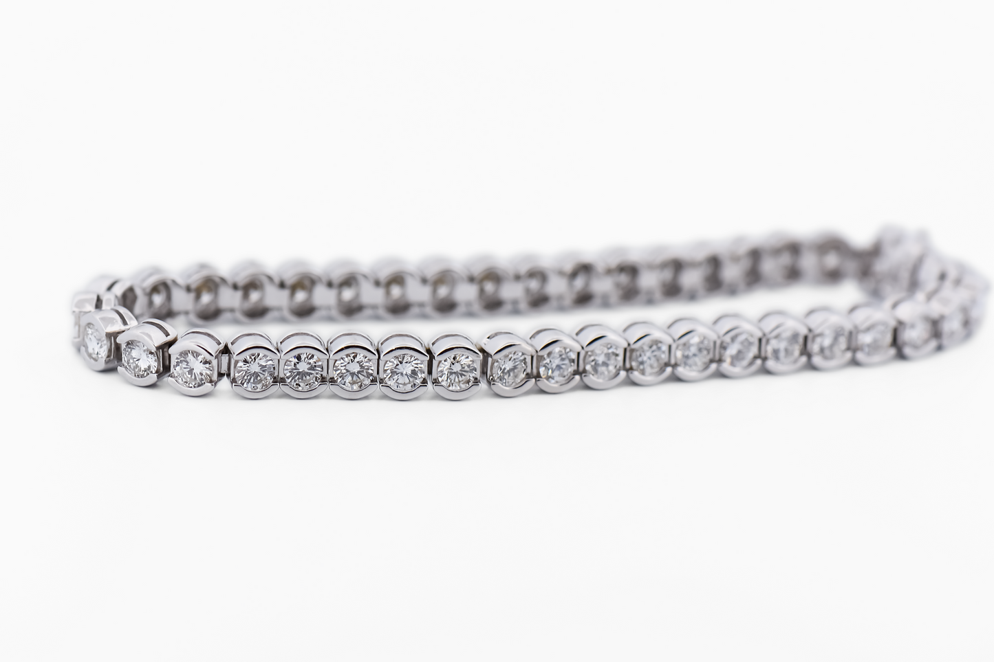 Luxurious Semi-Bezel Set Diamond Tennis Bracelet in 18k White Gold