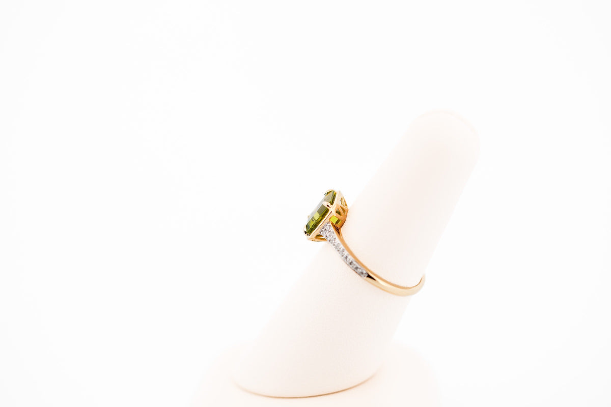 Modern Emerald Cut Peridot Ring with Diamond Accents in Yellow Gold