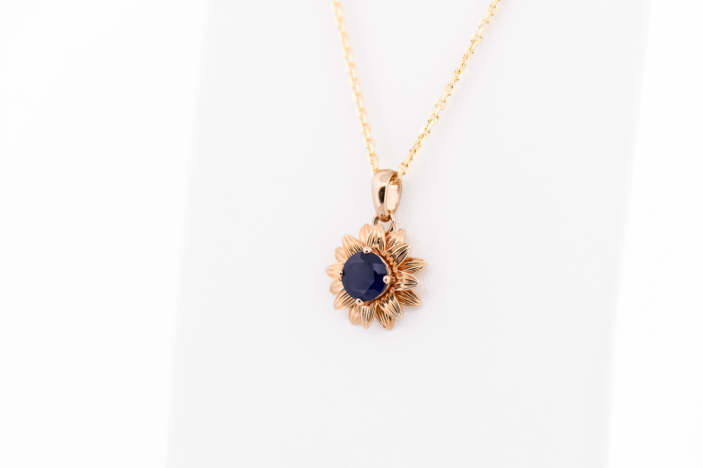 Navy Blue Sapphire Flower Pendant in Yellow Gold