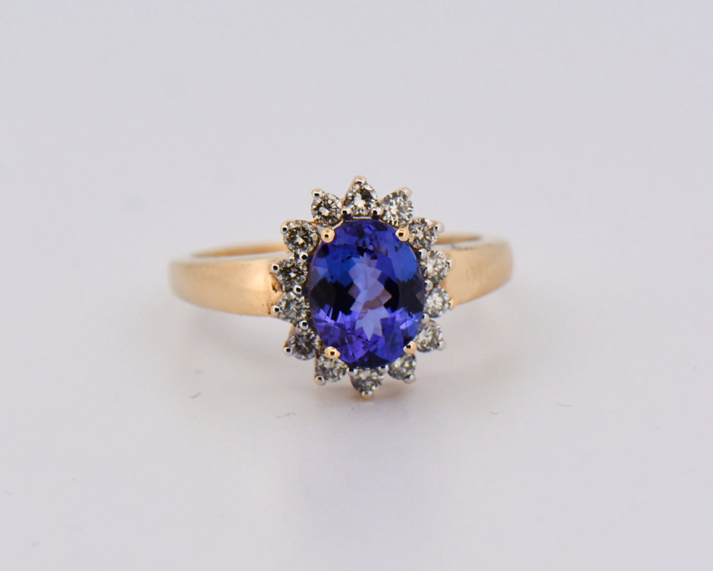 Oval Tanzanite & Diamond Halo Ring