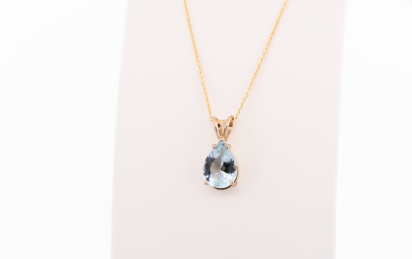 Pear Shape Aquamarine Solitaire Pendant in 14k Yellow Gold
