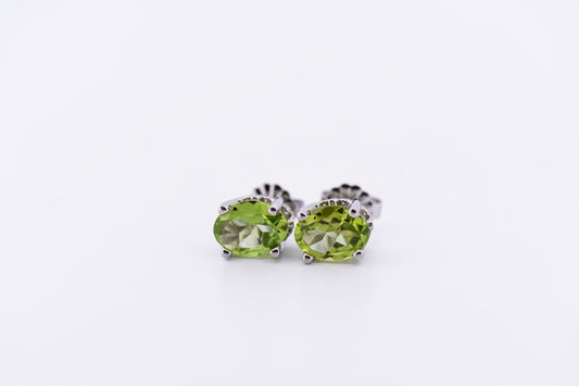 Oval Peridot Stud Earrings in White Gold