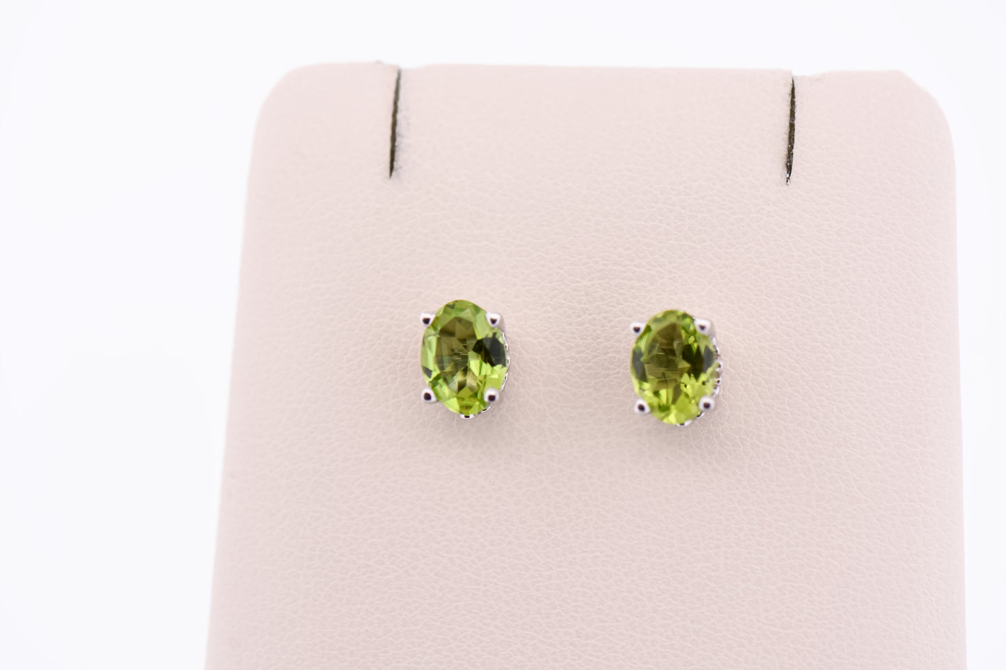 Oval Peridot Stud Earrings in White Gold