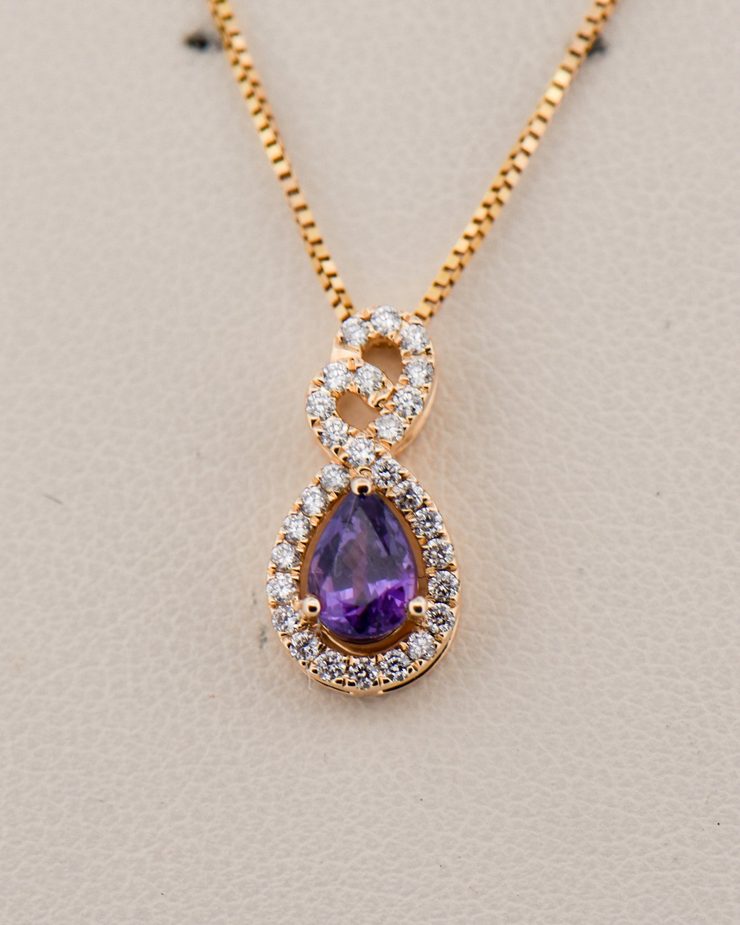 Purple Sapphire & Diamond Pendant in Yellow Gold
