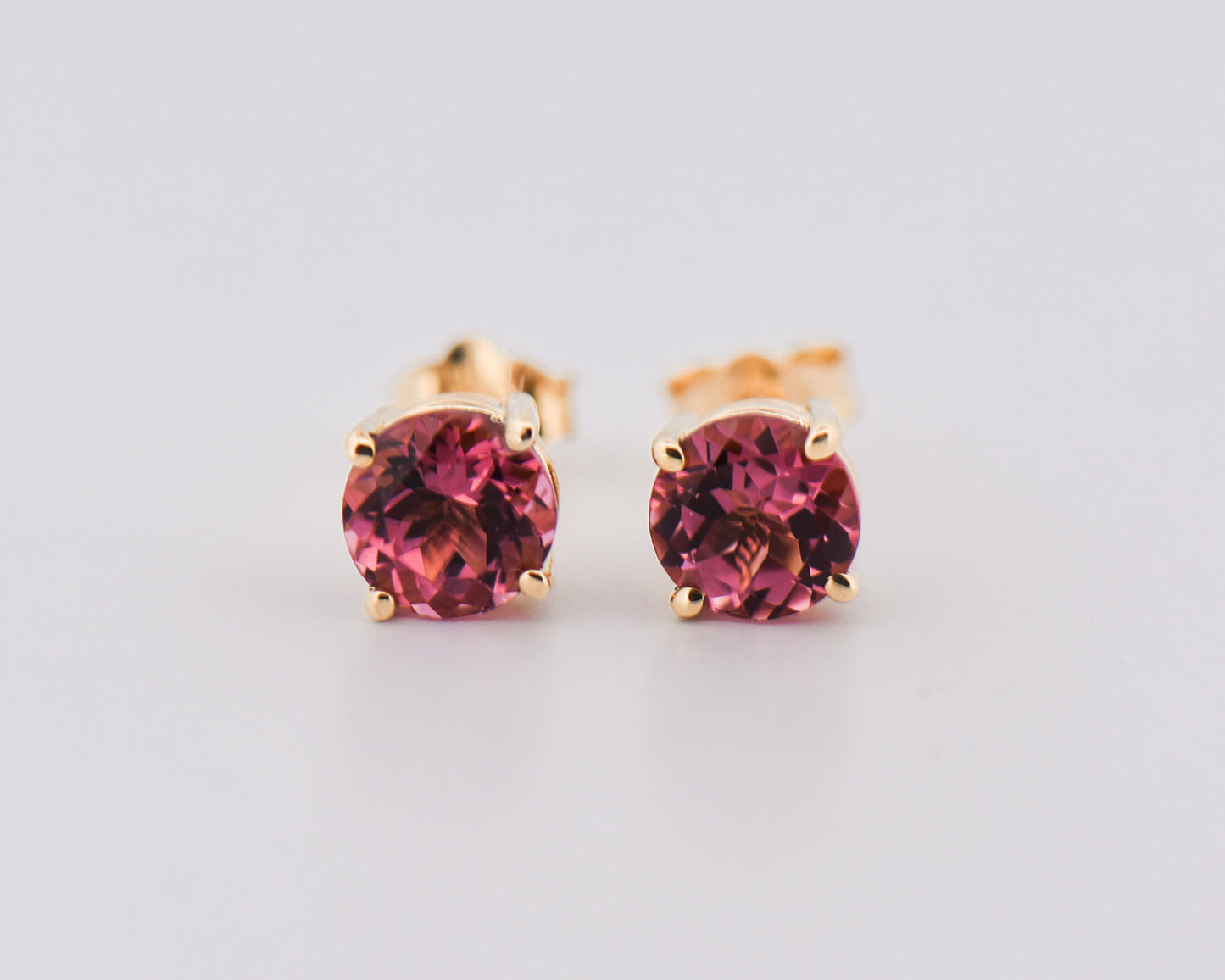 Round Pink Tourmaline Studs in Yellow Gold