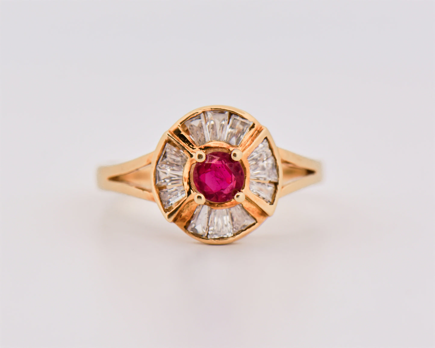 Round Ruby Halo Ring in Yellow Gold