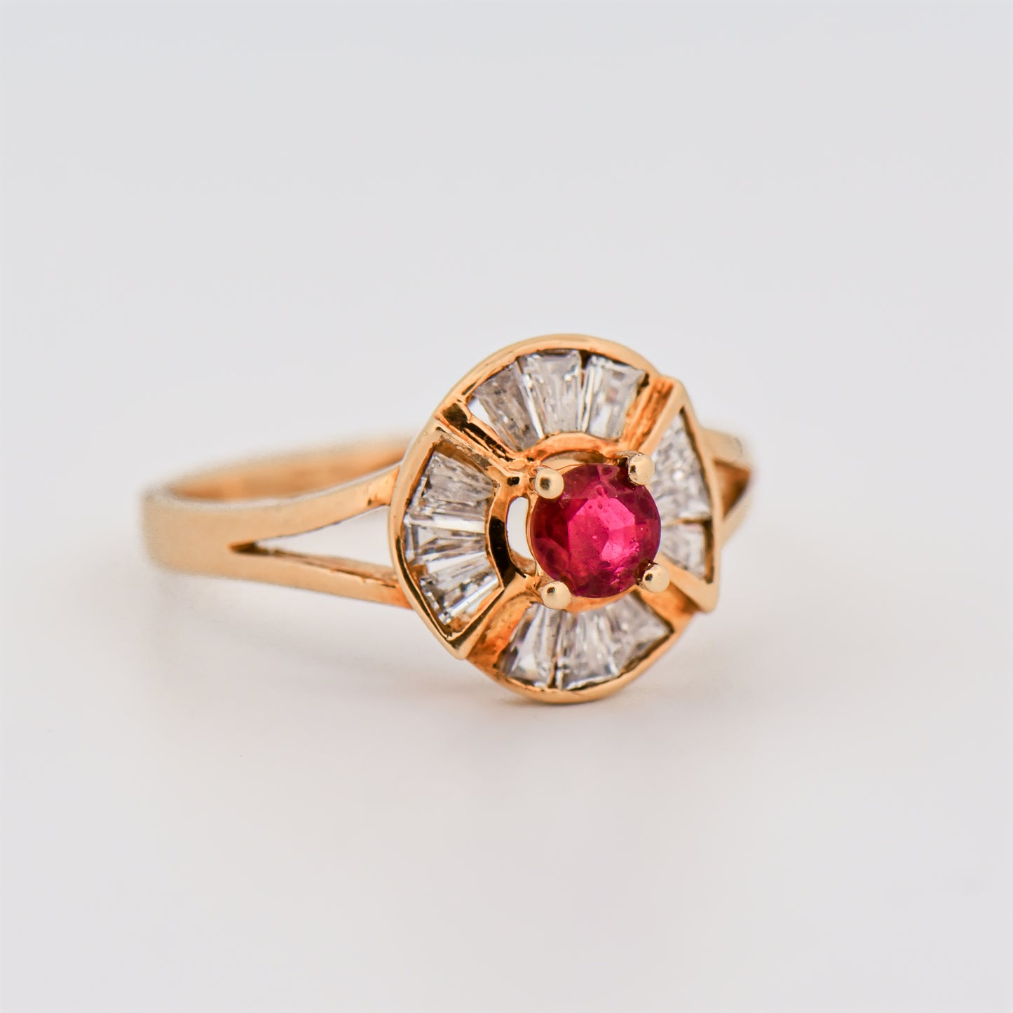 Round Ruby Halo Ring in Yellow Gold