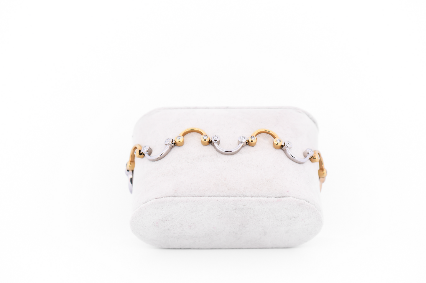 Swirling Two-Tone Gold Link Bracelet with Bezel Set Diamond Accents