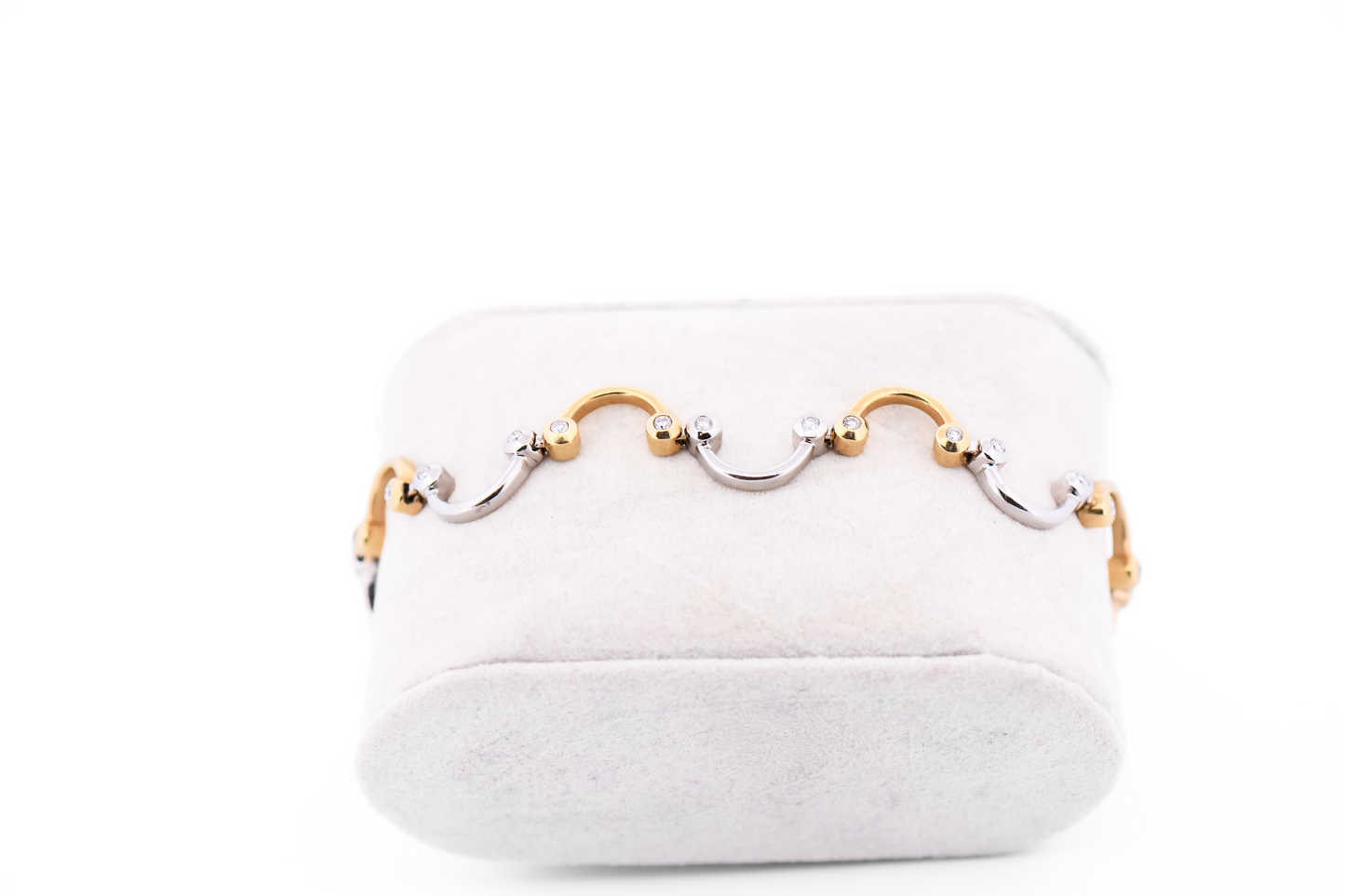Swirling Two-Tone Gold Link Bracelet with Bezel Set Diamond Accents