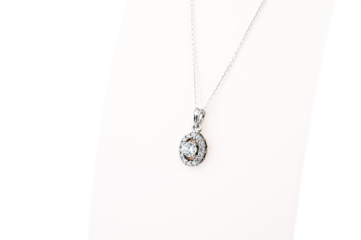 White Gold & Diamond Pendant - Round Diamond with Oval Halo Frame