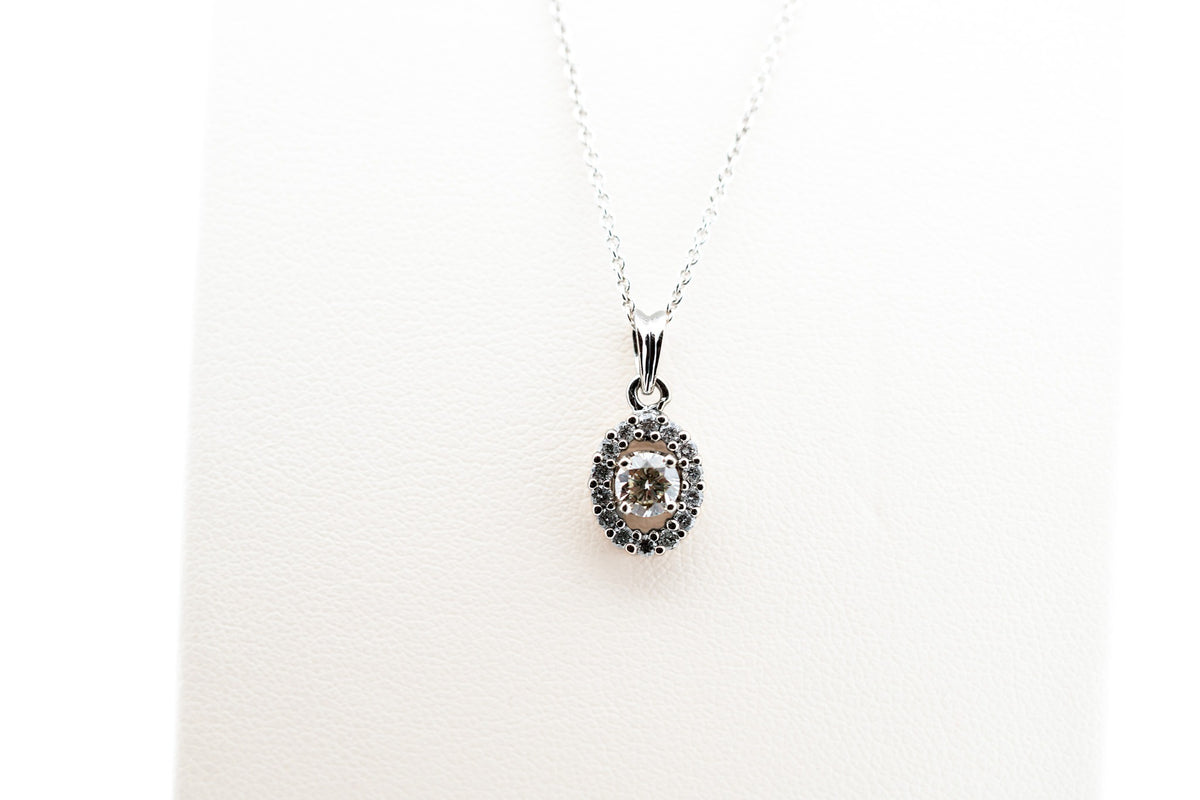 White Gold & Diamond Pendant - Round Diamond with Oval Halo Frame